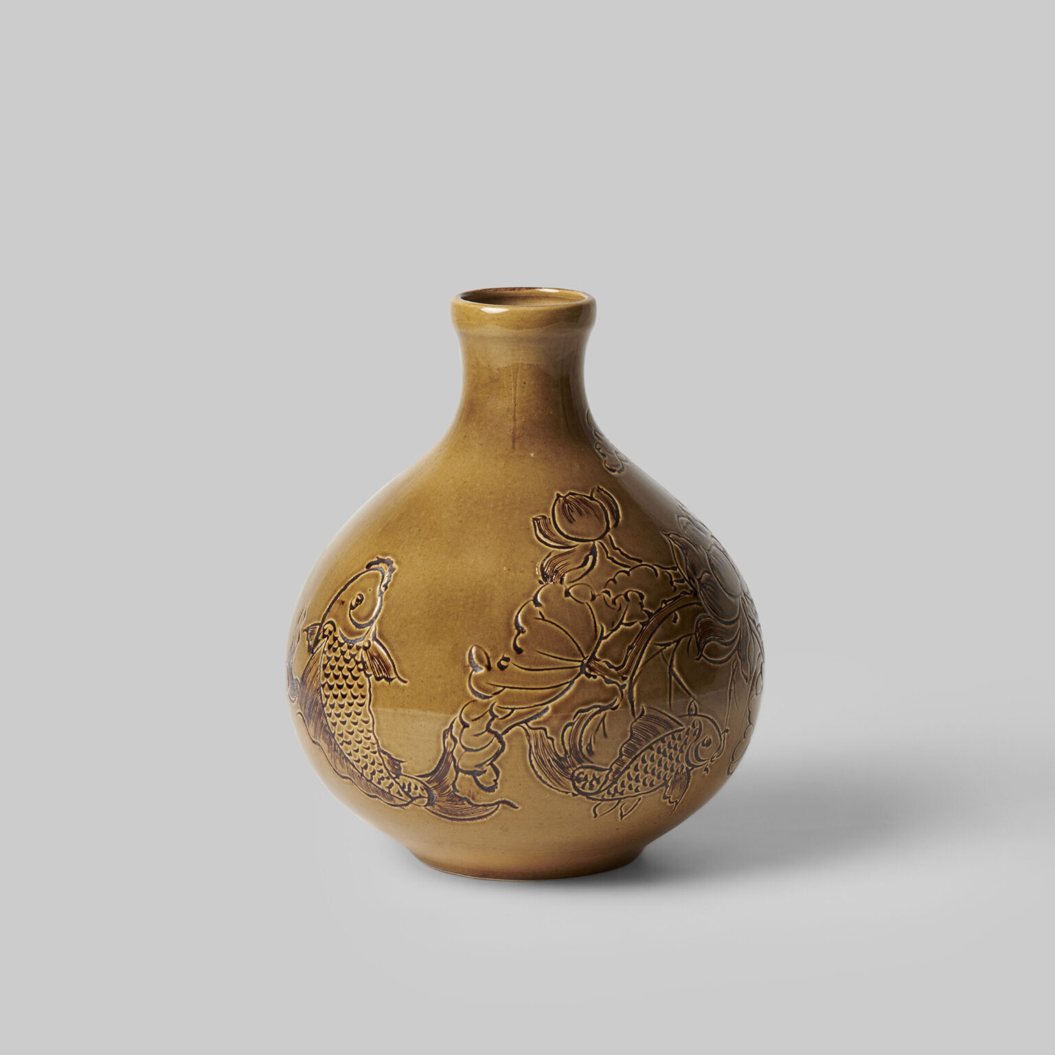 Brown enamel vase engraved with lotus and fish Bat Trang Museum BTMA